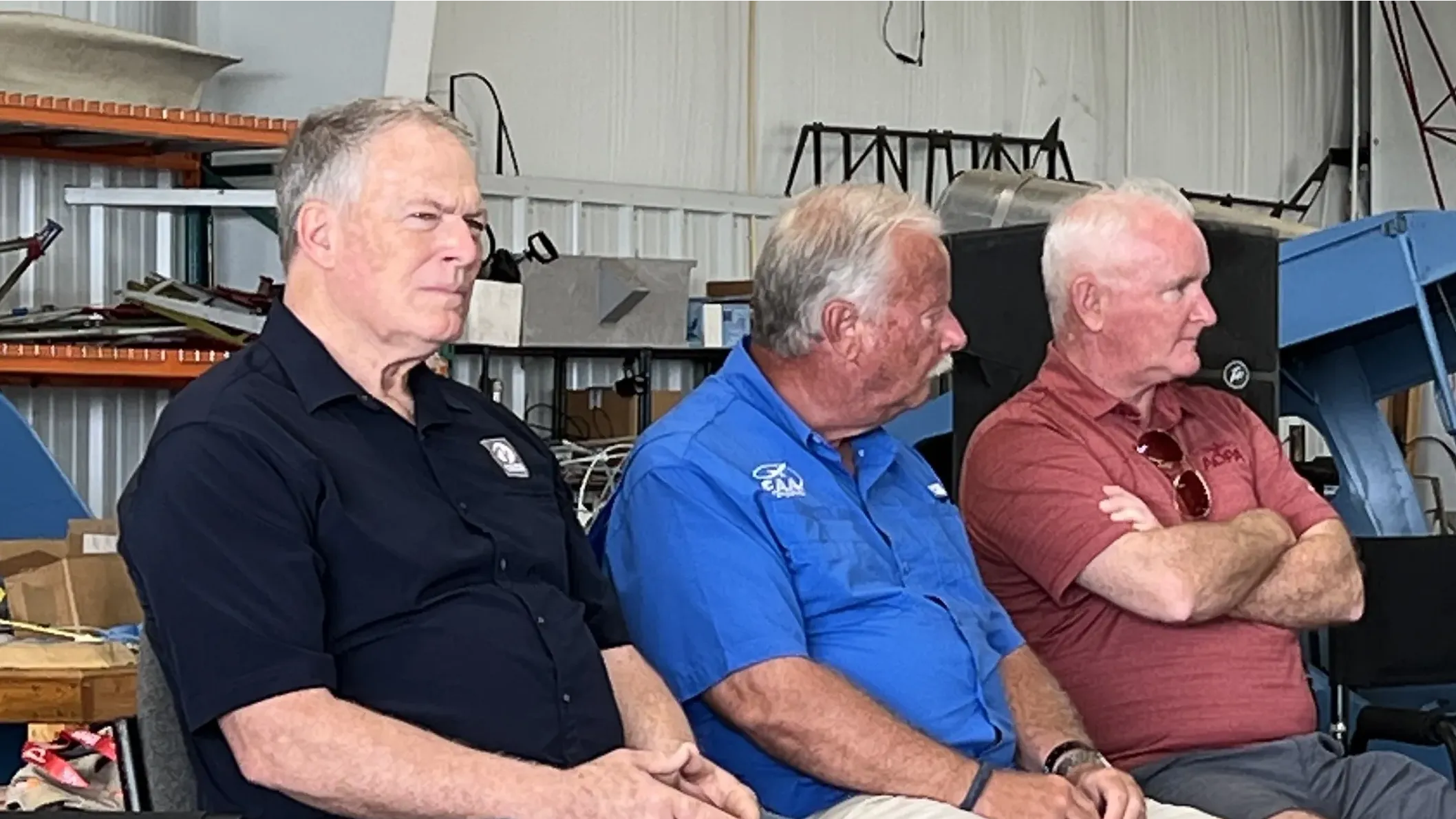 Pete Bunce, GAMA; Jack Pelton, EAA; and Mark Baker, AOPA, address the press at a town hall of unleaded avgas.